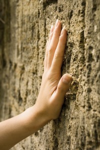Touching the stone wall